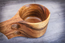 Laden des Bilds im Galerie-Viewer, Top view of a handcrafted Kuksa cup made from natural acacia wood, showing smooth inner surface and ergonomic double-hole handle
