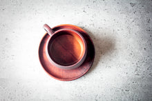 Laden des Bilds im Galerie-Viewer, Polished acacia wood cup and saucer displayed on white background

